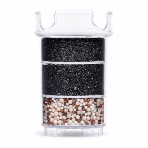 Cross-section of a Lotus Vita ENYA water filter cartridge, revealing its multi-layer system of activated carbon and mineral stones for water purification.